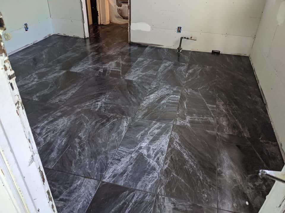 Large-format tile flooring installation