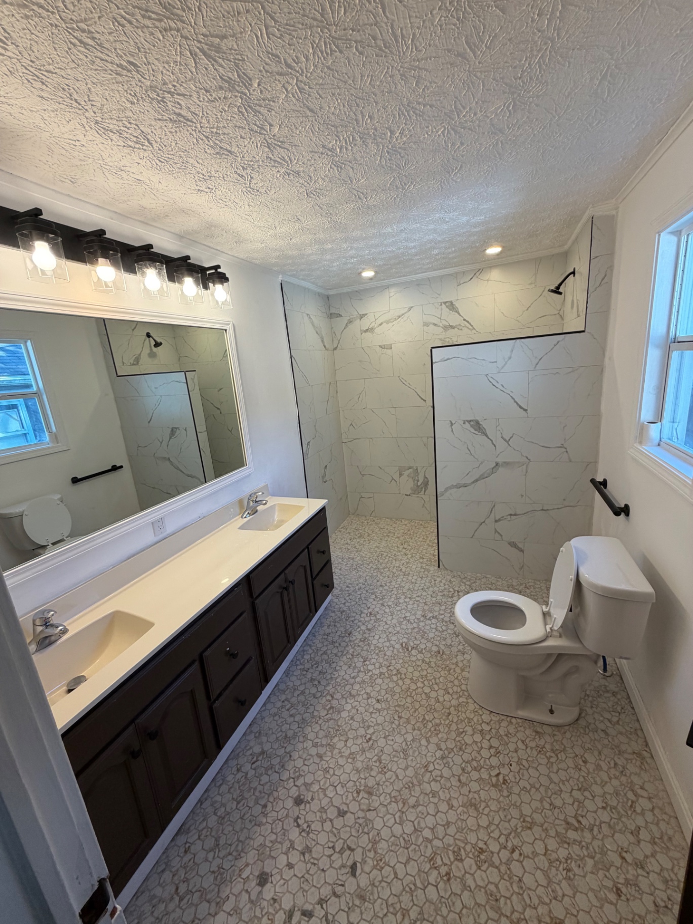 Marble tile bathroom renovation in Kokomo, Indiana